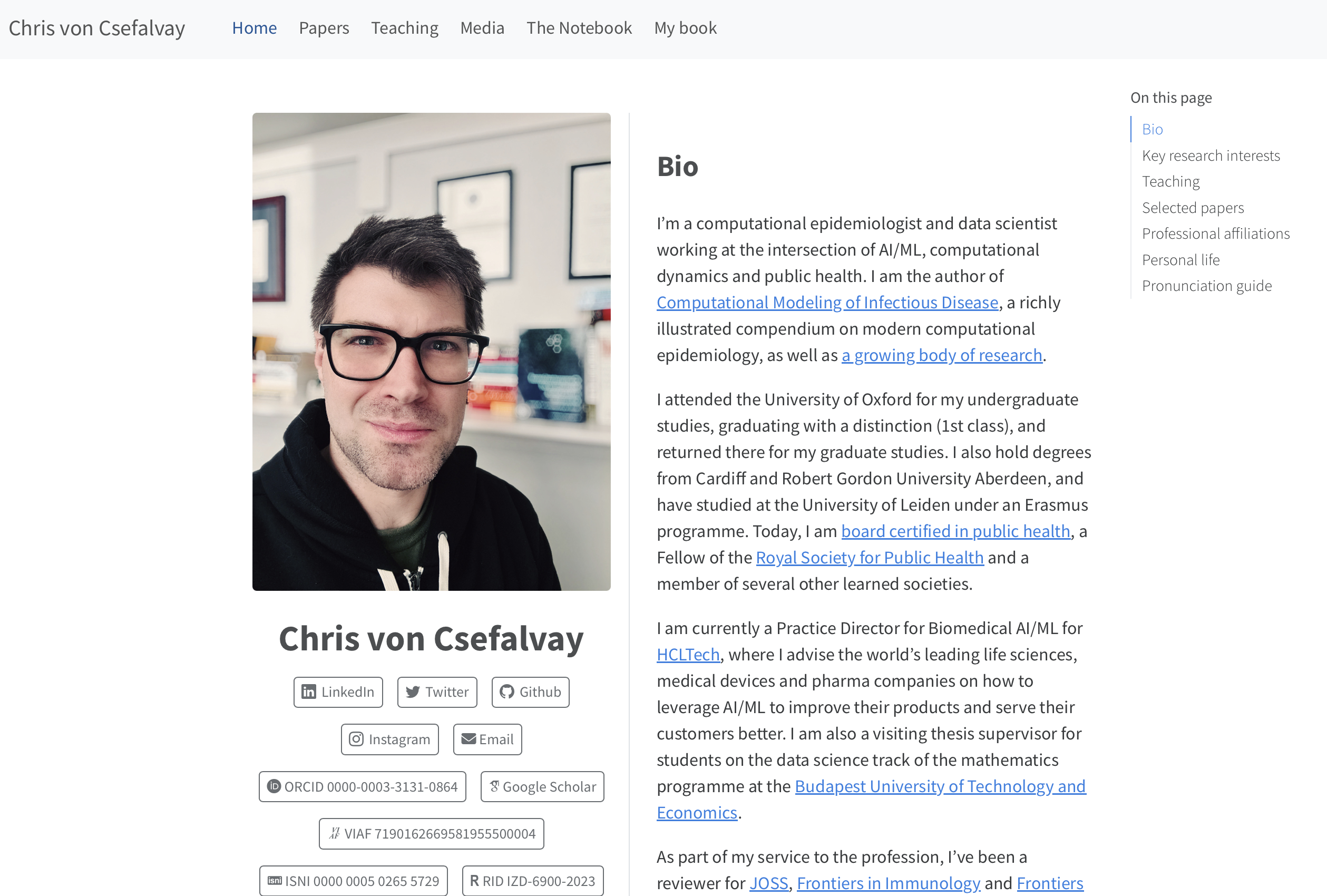 Personal bio page with a large headshot of a man in glasses beside biography text